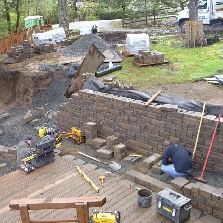 Stone retaining wall and steps under construction